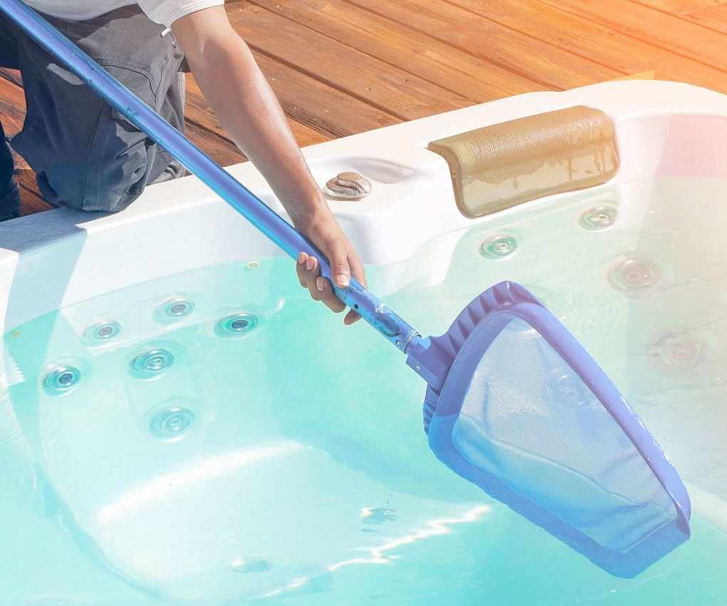 skimming the water in a hot tub