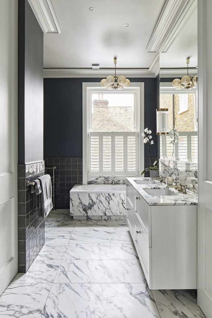 Bathroom with black and white marble and dark walls