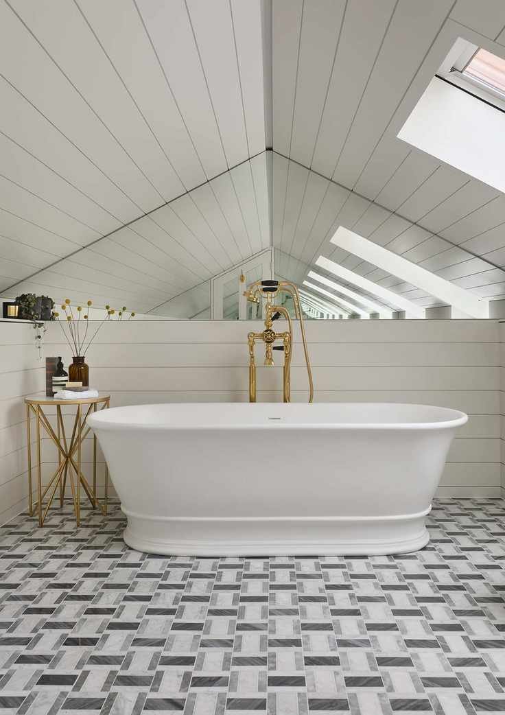 White bathroom with geometric marble flooring