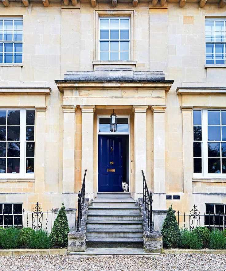 large house exterior with blue door