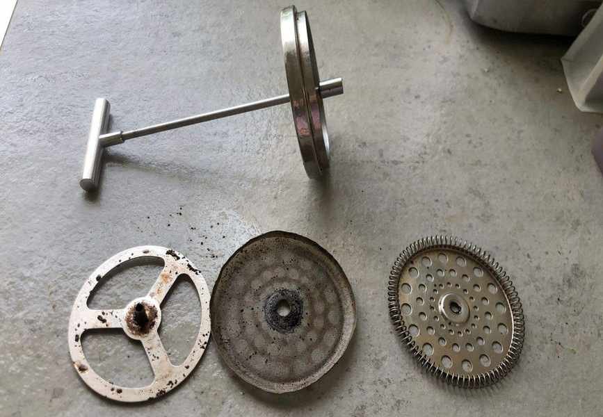 French press taken apart before cleaning