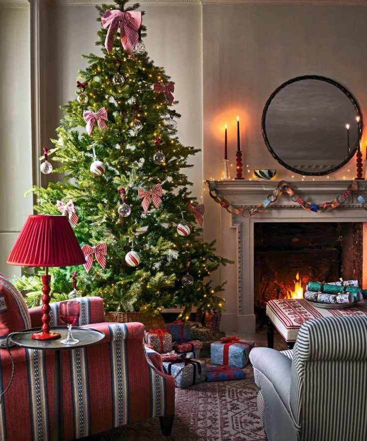 Cozy living room with a large Christmas tree
