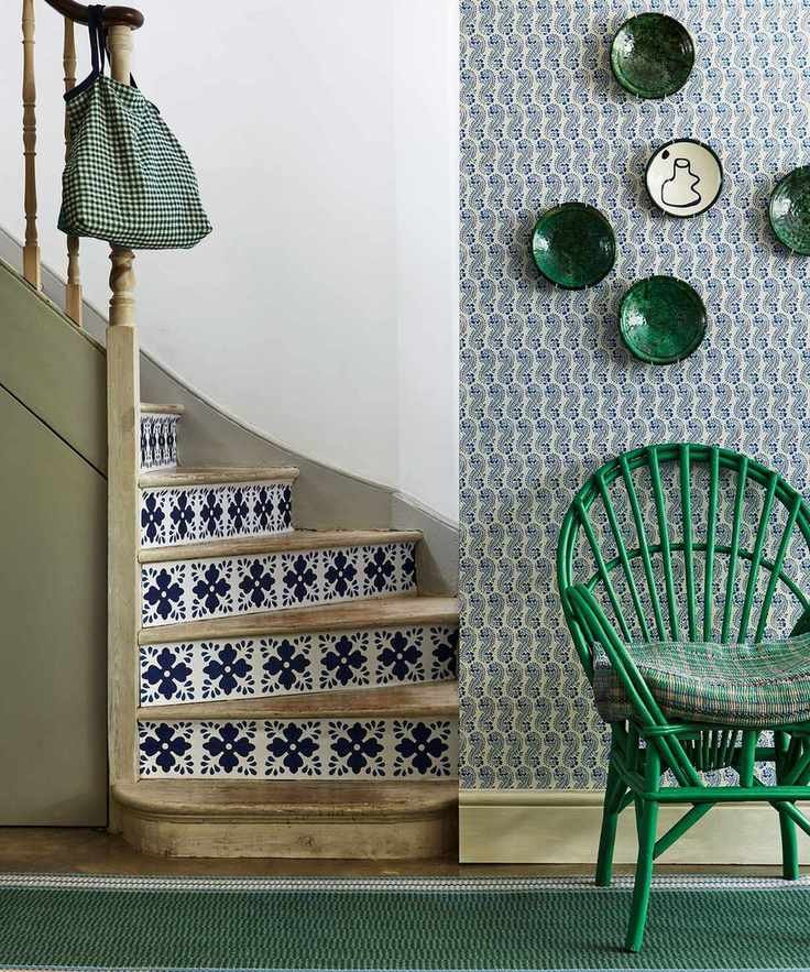 Modern hallway with patterned paper and green chair
