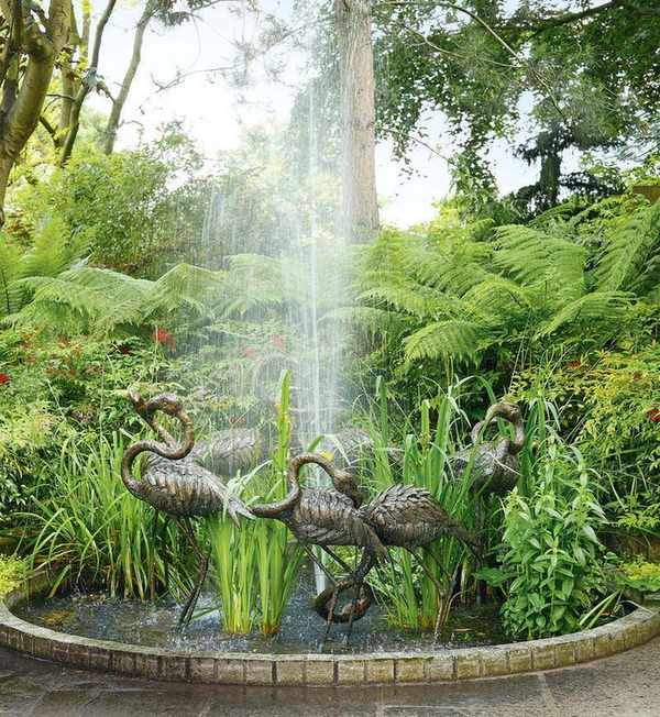 Tropical garden with water feature and ferns
