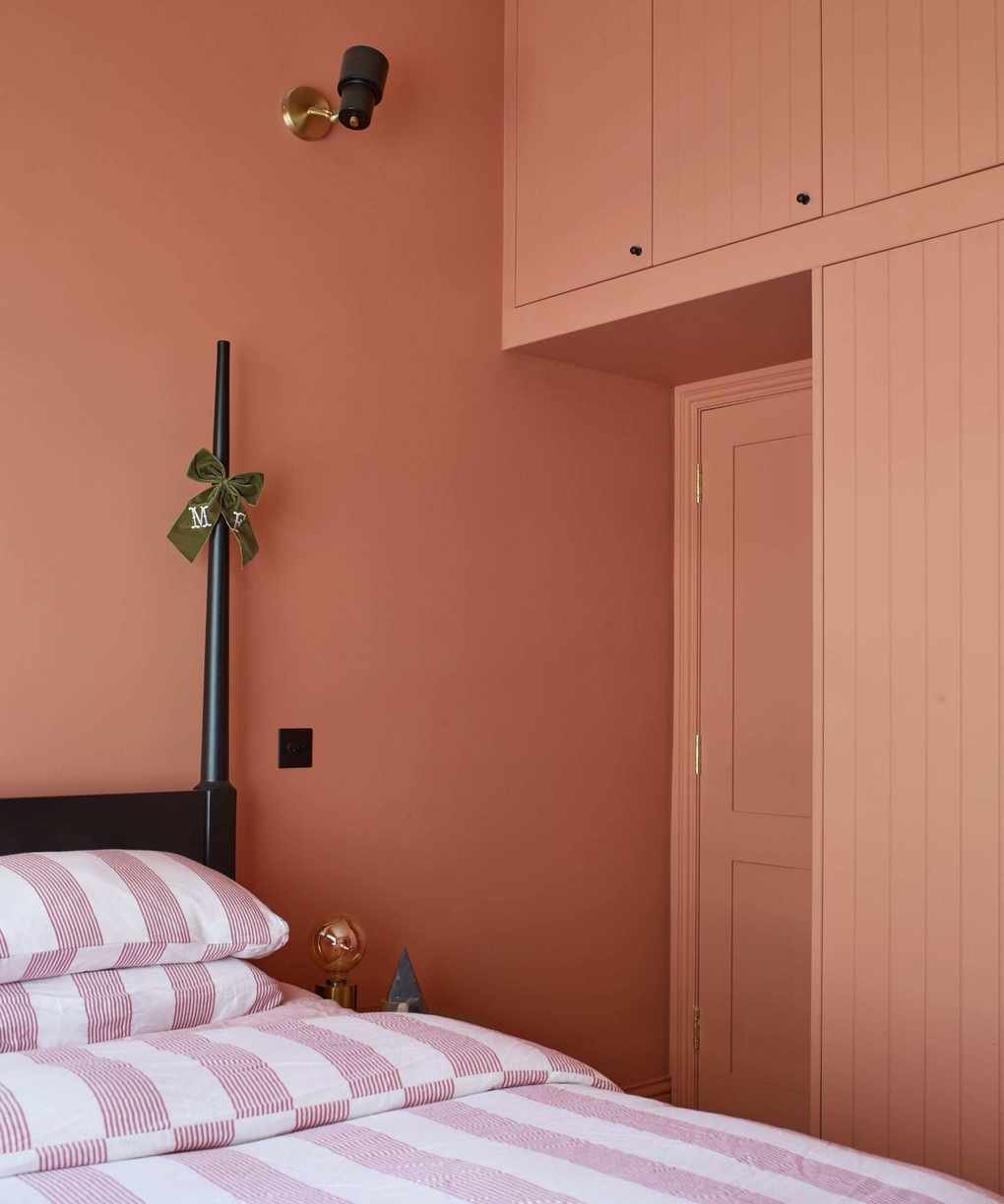 bedroom color drenched with muted red paint