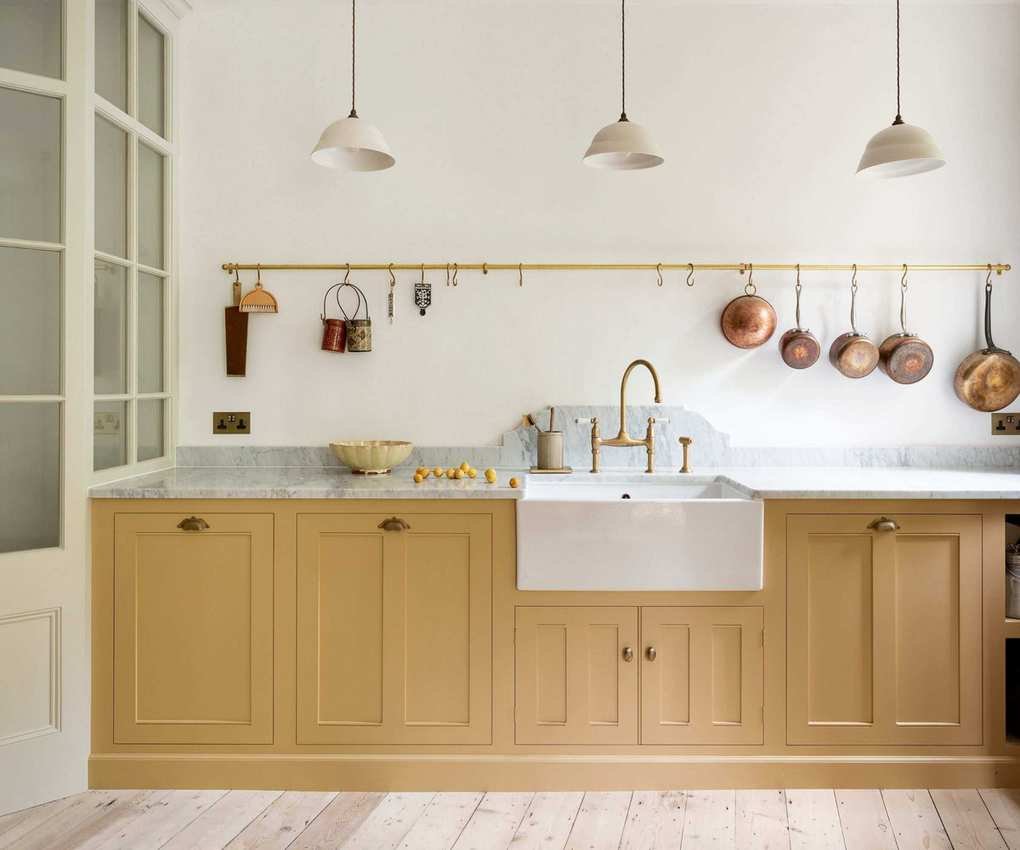 butter yellow kitchen cabinets, white wall, rustic decor