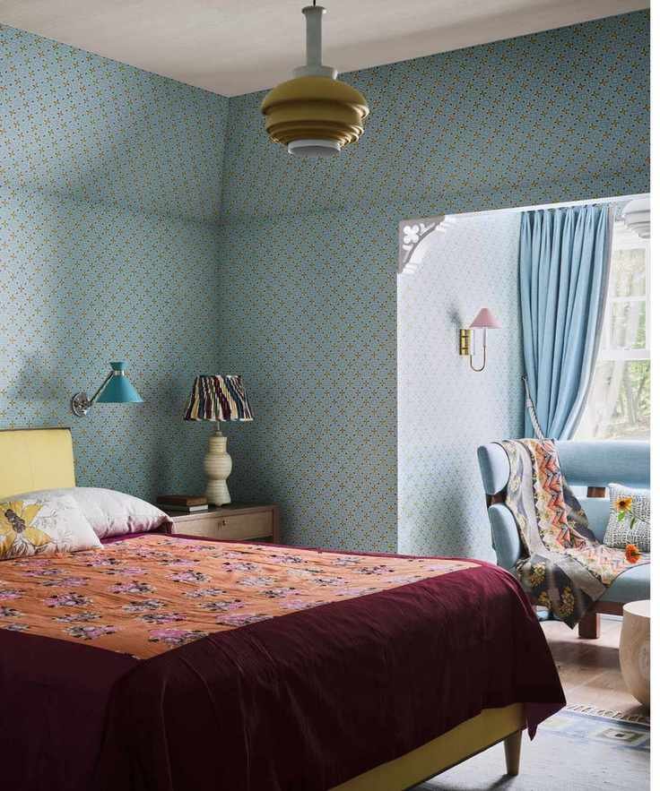 Blue bedroom with burgundy bedding