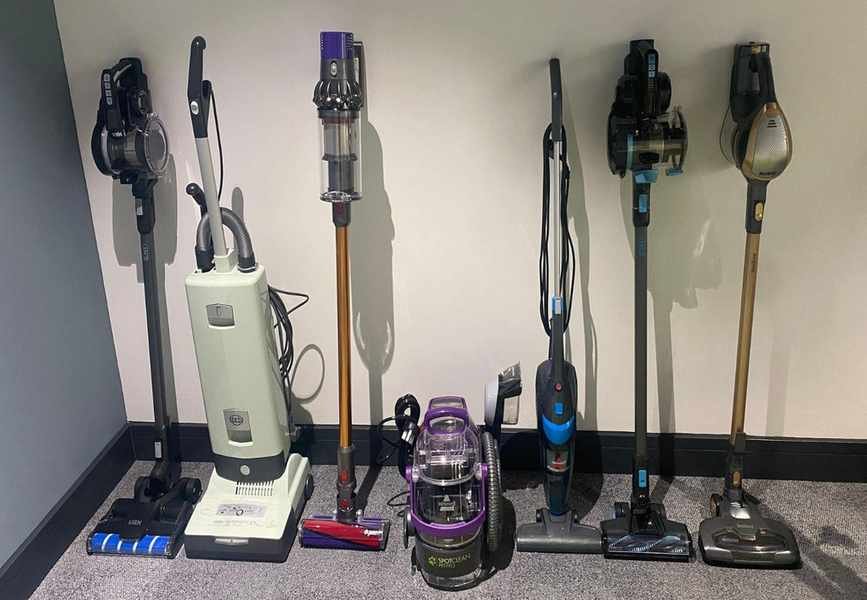 The vacuums which we tested lined up against a wall