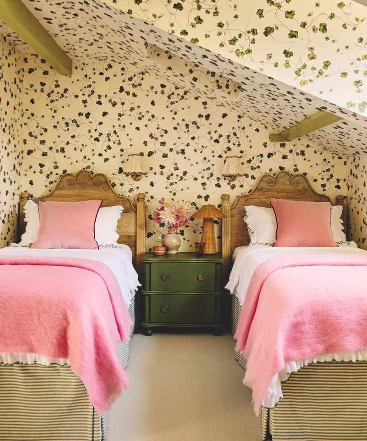 attic twin bedroom with trailing ivy printed wallpaper on all walls and ceiling