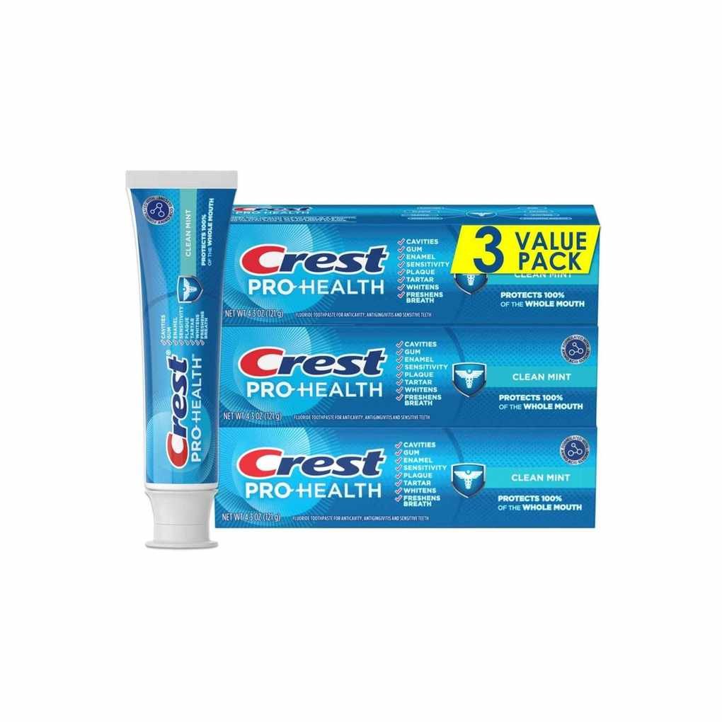 Crest toothpaste blue bottle standing upright on its white cap, alongside three horizontal boxes stacked on top of each other next to it