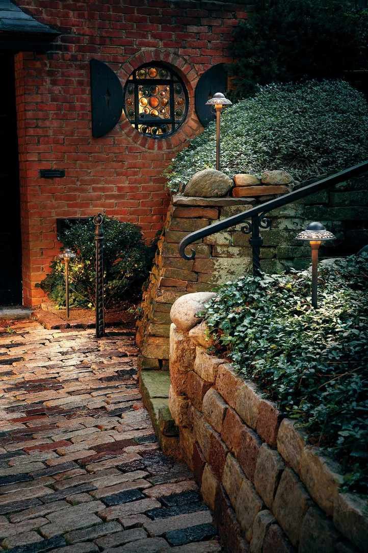 Solar lighting in raised brick wall at front of house