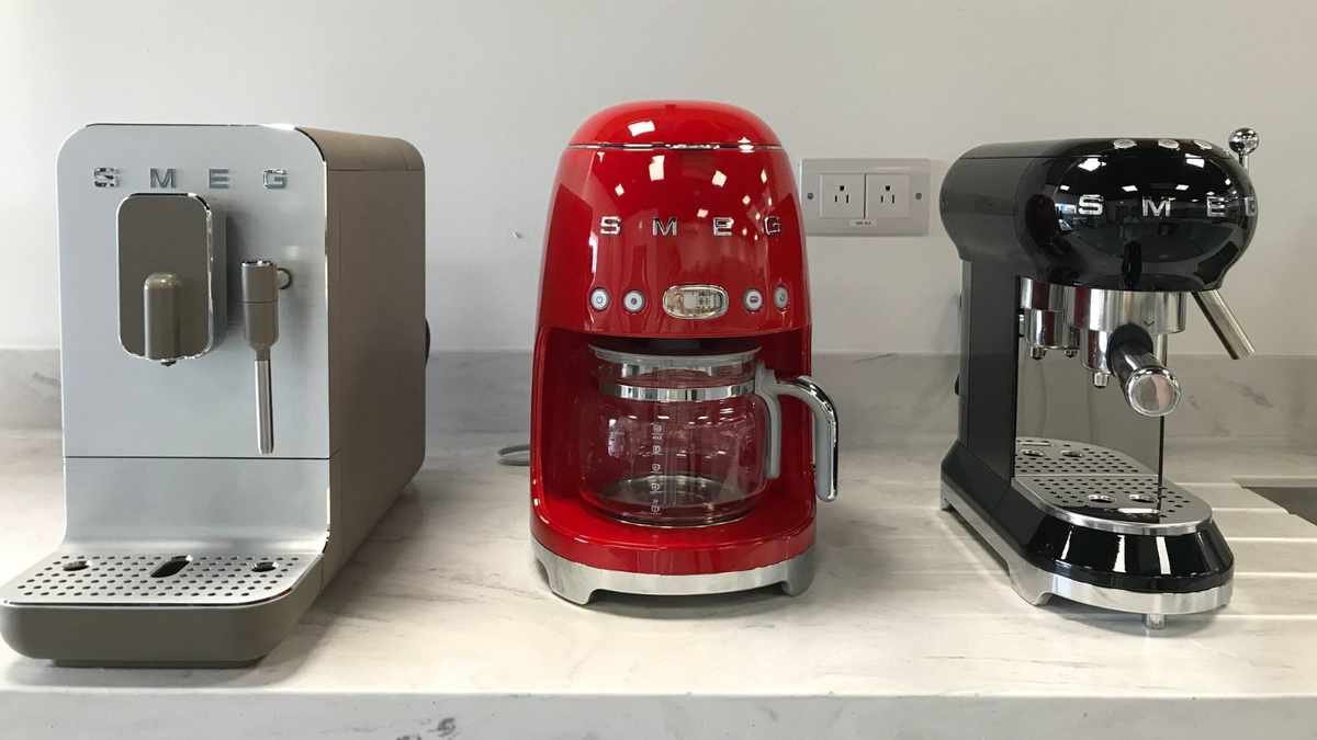 Smeg drip coffee maker alongside other coffee machines