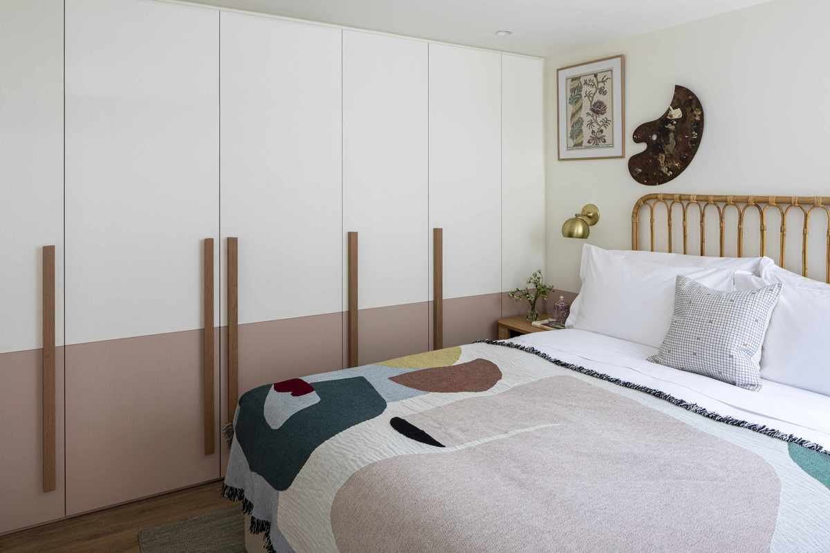 teen girl bedroom idea, double bed, painted wardrobes, artist palette and artwork on wall