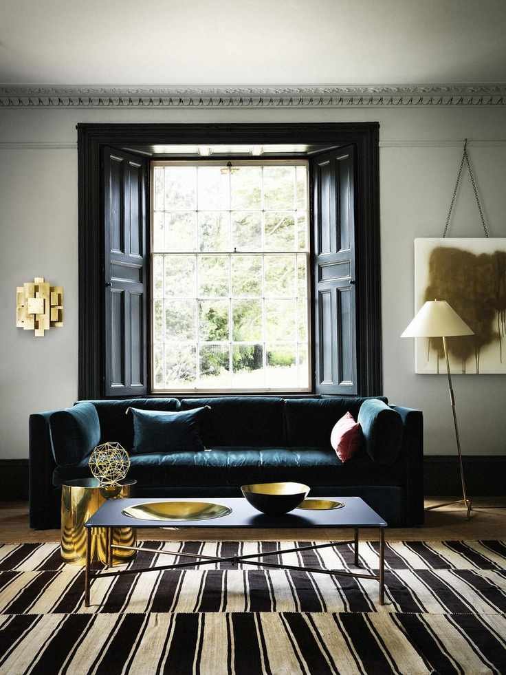 Bay window featuring traditional wooden shutters