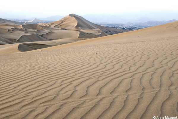 Experience Sandboarding Adventures in Huacachina, Peru