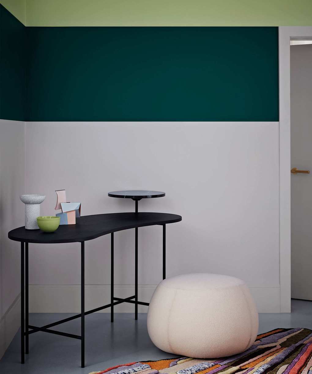 Hallway with white and green walls showcasing two shades of green