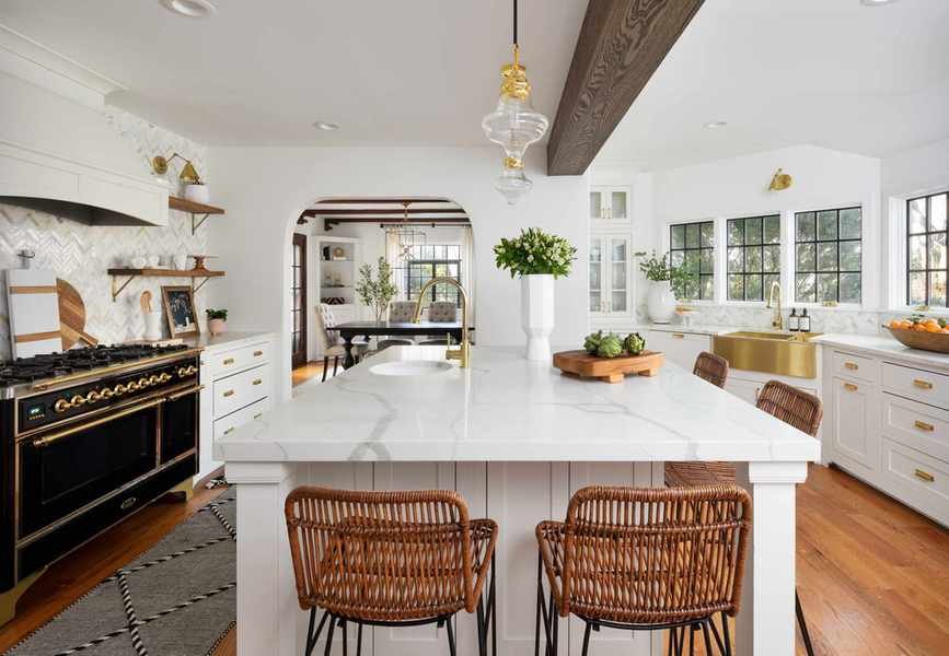 kitchen with white marble island top and black range cooker